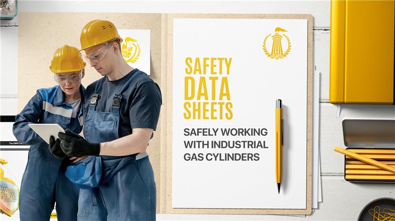 Two workers in safety gear reviewing a tablet, next to a document titled 'Safety Data Sheets: Safely Working with Industrial Gas Cylinders,' with the ISDSS™ logo and yellow stationery.